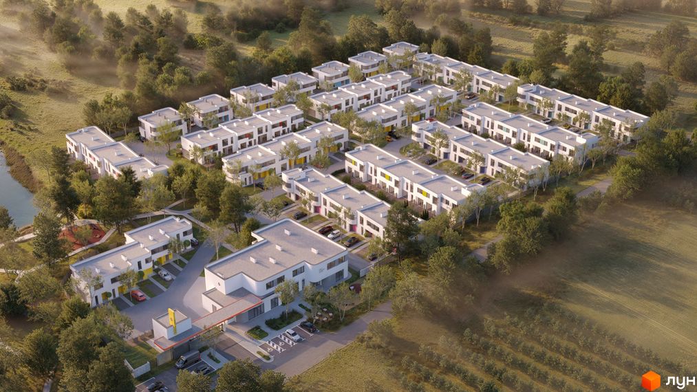 Котеджне містечко ARTPARK з білими будинками та зеленими деревами навколо. Огляд житлового комплексу з повітря.