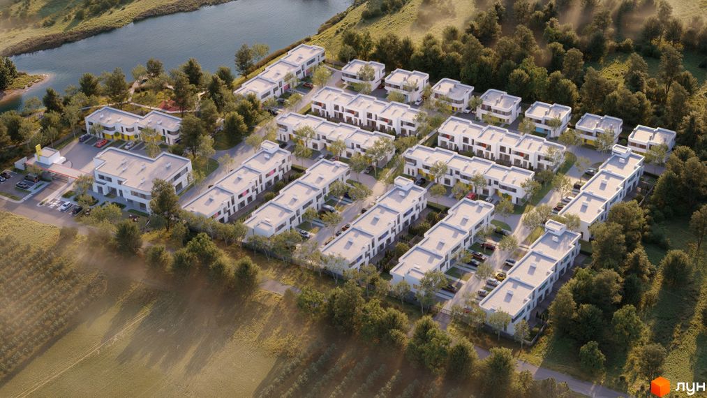 Котеджне містечко ARTPARK з білими будинками та прибудинковою територією з деревами та озером. Вид зверху на житловий комплекс.