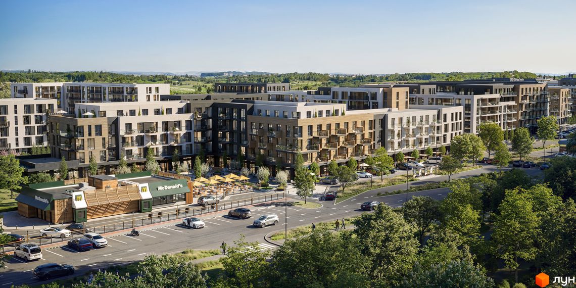 Житловий комплекс Central Park – це сучасні багатоповерхові будинки з балконами та парковкою, розташовані біля дороги з деревами.