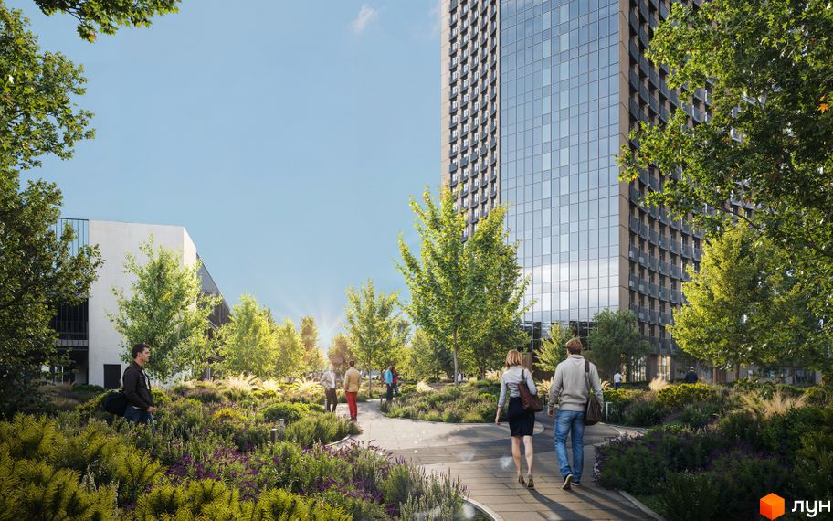 Житловий комплекс BEREG Residence з високою скляною будівлею та зеленою прибудинковою територією з пішохідними доріжками.