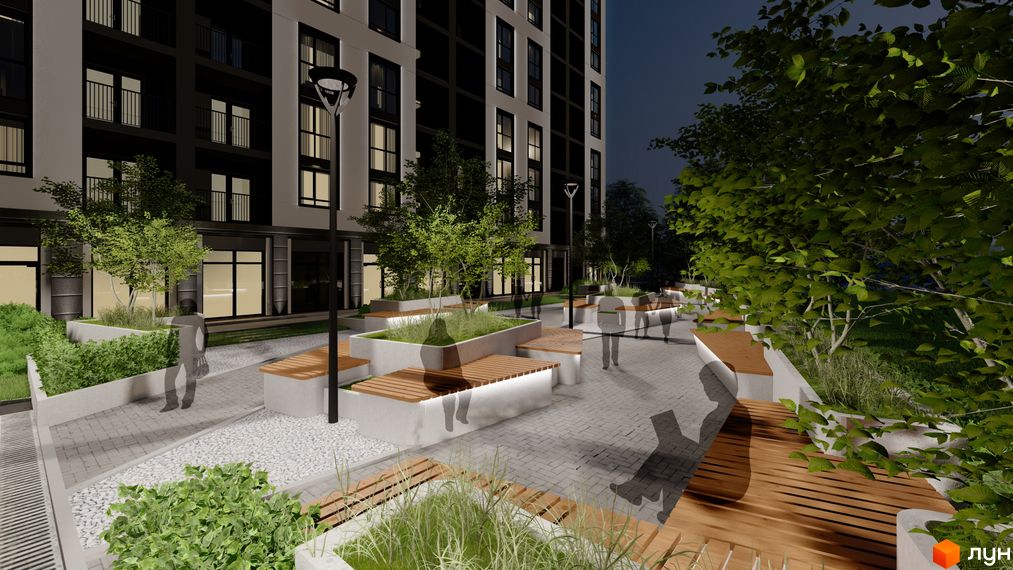 Зовнішній вигляд житлового комплексу Квартал №5 з підсвіченими вікнами та балконами, з прибудинковою територією з лавками та деревами.