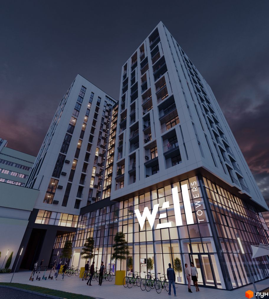 Апарт-комплекс WELL towers з фасадом зі скла та білої плитки, що має великі вікна та балкони. Перед комплексом розташована зона відпочинку з велосипедами та самокатами.