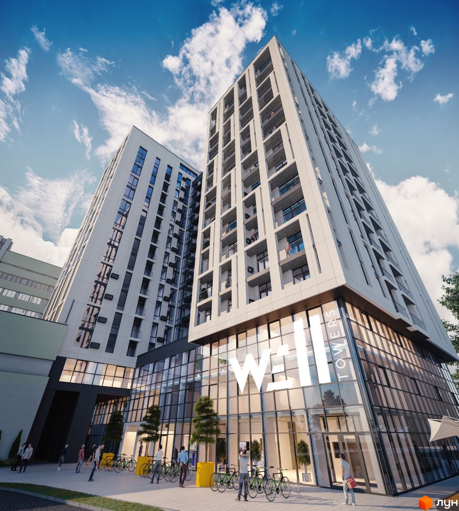 Апарт-комплекс WELL towers з білими фасадами та скляним цоколем. На прибудинковій території розташовані зелені зони та місця для паркування велосипедів.