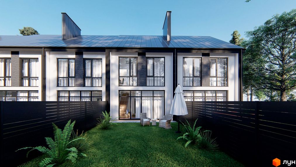 Ряд двоповерхових будинків з білими та темними фасадами, великими вікнами. Перед будинками зелений газон з меблями та чорним парканом.