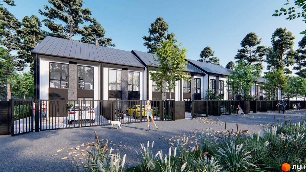 Ряд двоповерхових будинків з білими фасадами та темними дахами. Перед ними огороджена територія, дорога та зелені насадження.