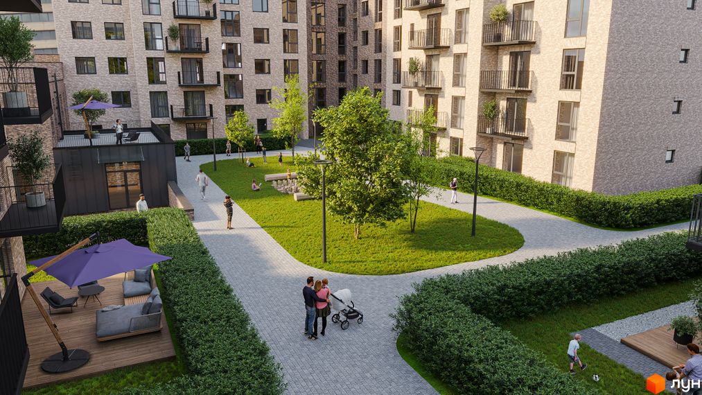 Житловий комплекс WAWEL з цегляним фасадом та просторим внутрішнім двором із зеленими зонами та місцями для відпочинку.