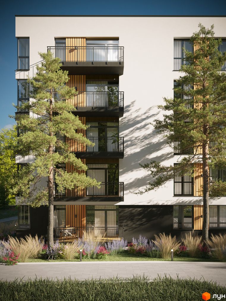 Фасад Житлового комплексу SVOЇ PARKHOUSE з білими стінами, темними балконами та дерев'яними елементами. Перед будинком зелені насадження та доріжка.