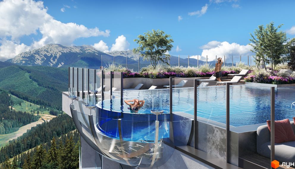 Апарт-комплекс Mountain Residence з басейном на даху та видом на гори. Навколо комплексу зелені насадження та квіти.