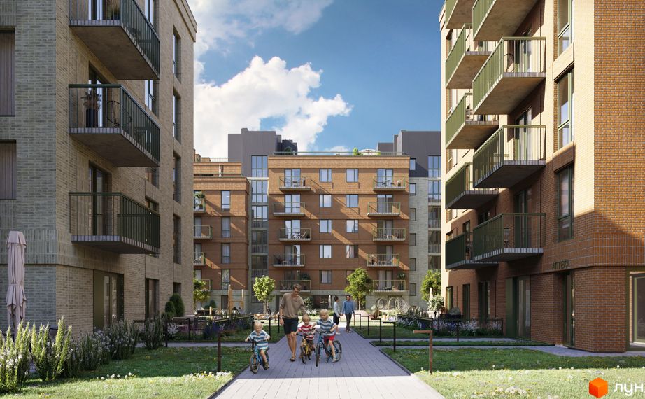 Зовнішній вигляд житлового комплексу WAWEL з цегляними фасадами та балконами, що виходить на зелену прибудинкову територію з дитячою зоною.