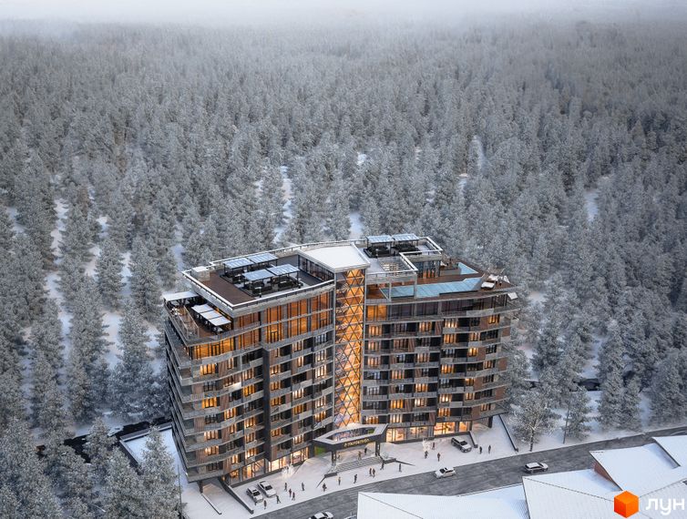 Апарт-комплекс KARDAMON RESORT & SPA у зимовому лісі. Будівля має багатоповерхову структуру з панорамними вікнами та терасами на даху.