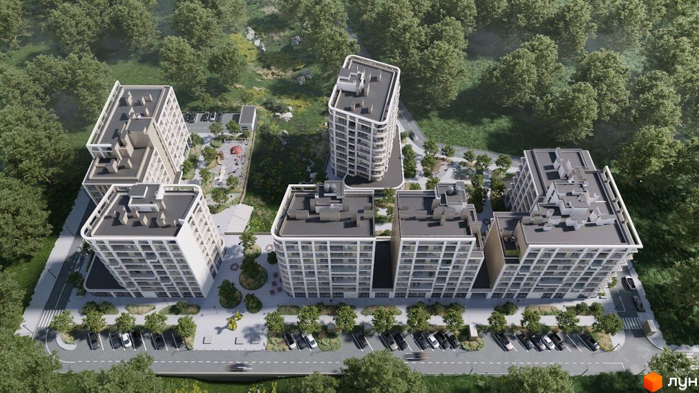 Житловий комплекс ШЕЛЕСТ: вид зверху на кілька багатоповерхових будівель з білими фасадами, оточених зеленими насадженнями, парковками та дитячим майданчиком.